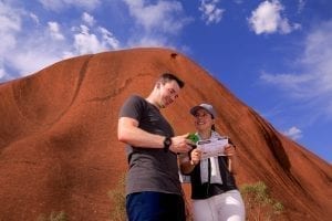 two travellers explore Uluru using an Uluru Audio Guide